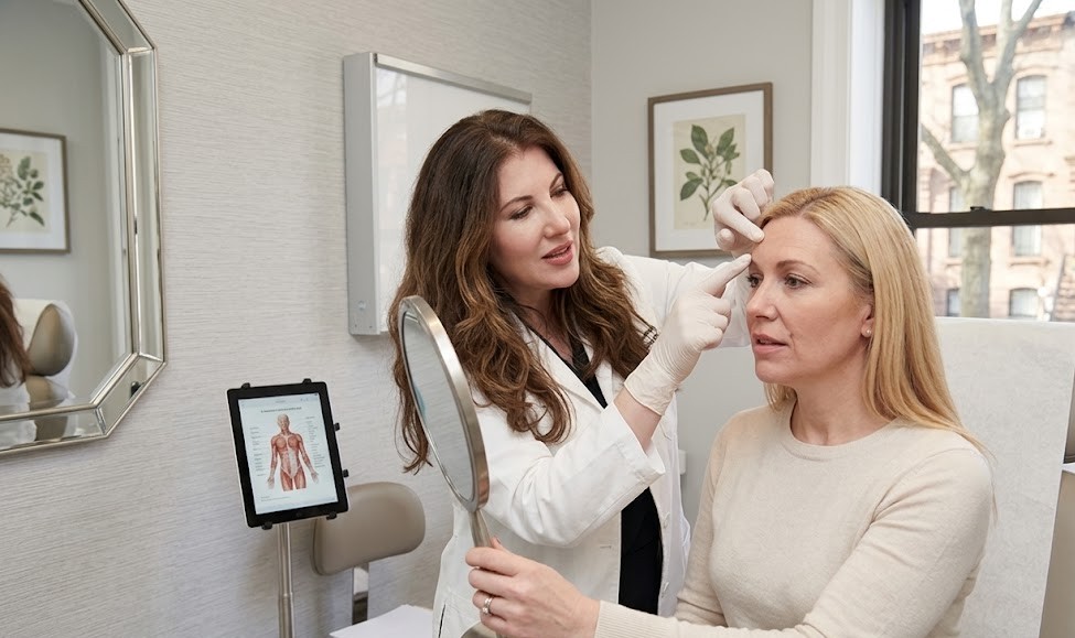 anti aging treatment consultation botox dermal fillers Brooklyn NYC diverse patients doctor discussion
